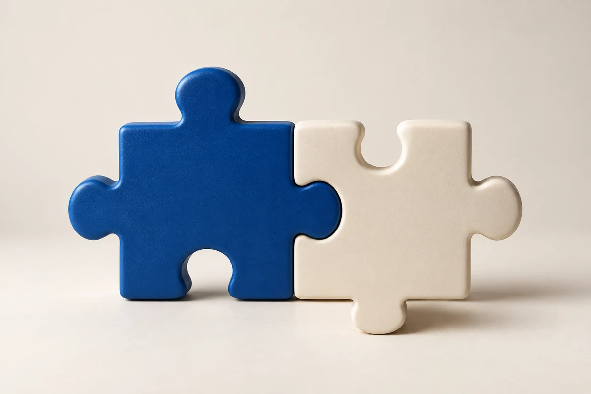 Blue and white puzzle pieces joining together, with subtle camera movement